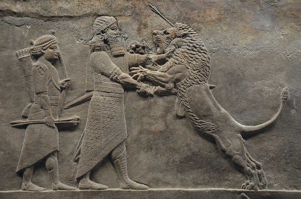 Ashurbanipal killing a lion.