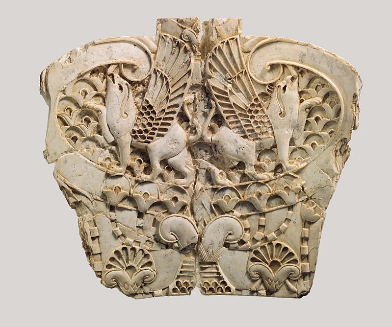 Ivory plaque with two griffins in a floral landscape, Phoenician style. Metropolitan Museum of Art.