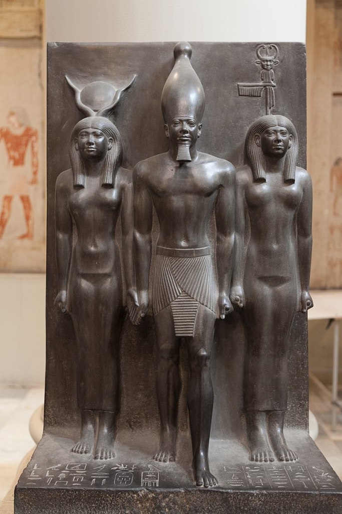 Menkaura flanked by the goddess Hathor and the goddess Bat. Egyptian Museum, Cairo.